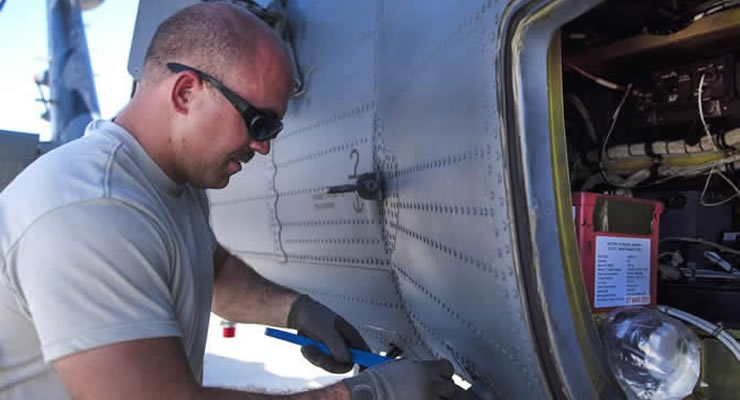 Soldier repairs helicopter